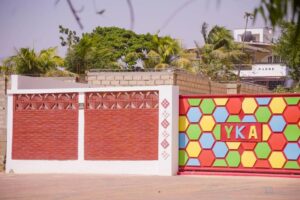 A colorful wall with a sign on it