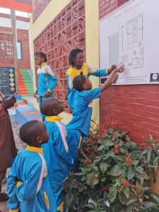 A group of children standing around each other.