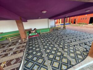 A room with purple ceiling and tiled floor.