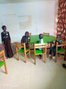 A group of people sitting around a table.