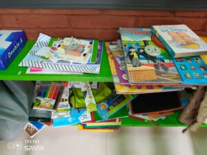 A table with books and magazines on it