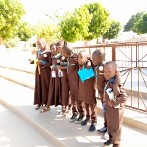 A group of young children standing next to each other.