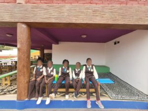 A group of children sitting on top of a couch.